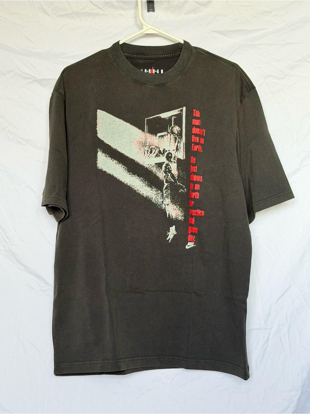 Jordan Men’s Black Graphic Basketball Short Sleeve Tee with Red Accent